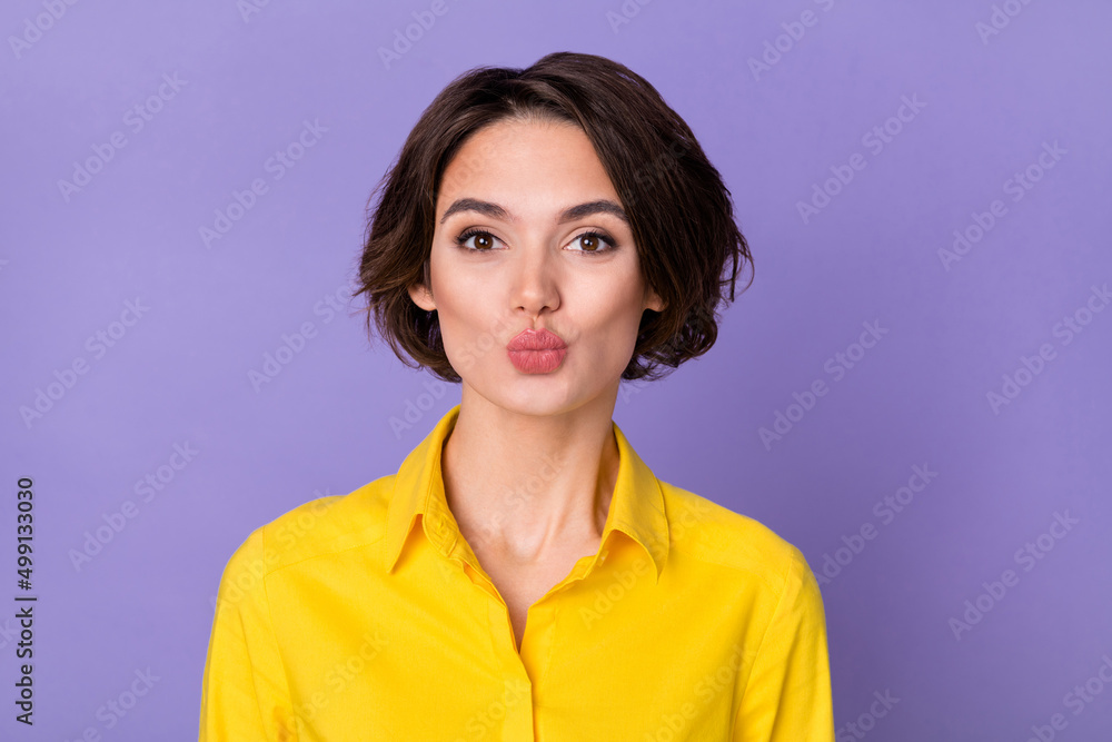 Photo of cute millennial ceo lady blow kiss wear yellow outfit isolated on violet color background Photo of cute millennial ceo lady blow kiss wear yellow outfit isolated on violet color background