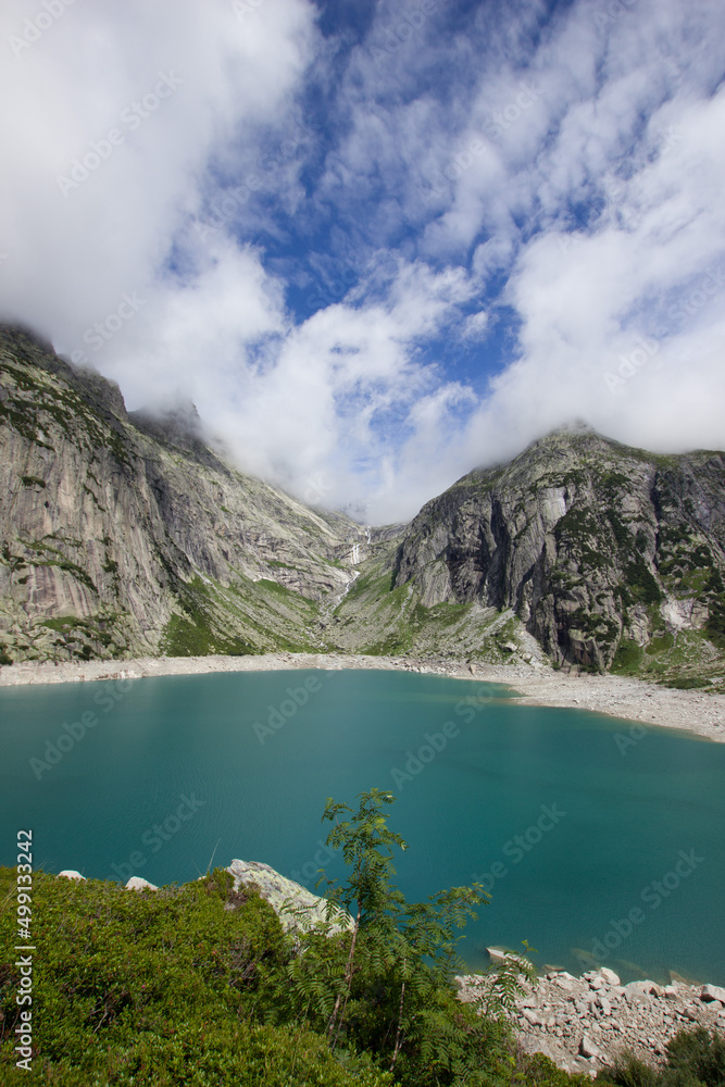 stunning blue Gelmersee in the swiss alps