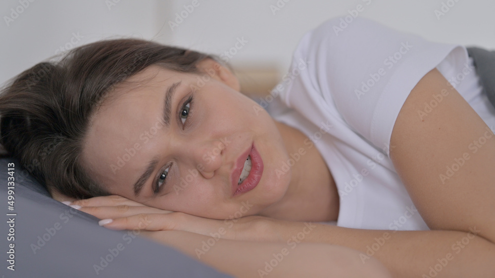 Woman Talking on Video Call while Laying in Bed Woman Talking on Video Call while Laying in Bed