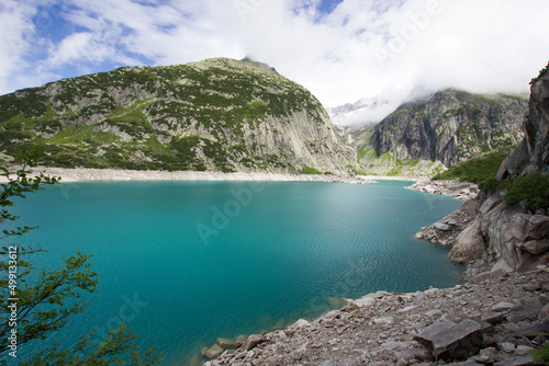 Picturesque blue Gelmersee in the Bernese Oberland photo