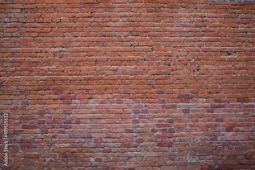 Weathered stained old brick wall . Texture of bricks . Panoramic view