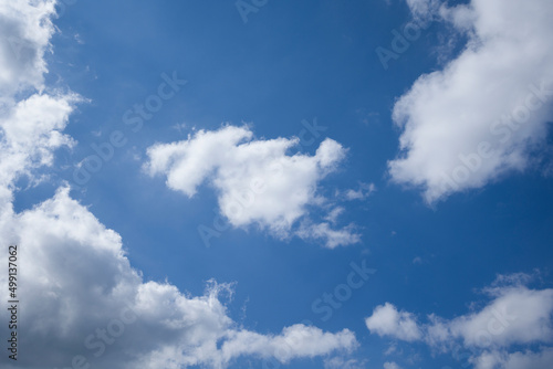 White  fluffy clouds in blue sky.