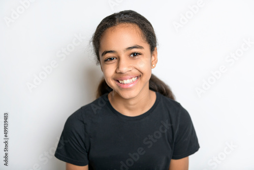 Beautiful black teen posing on studio white background