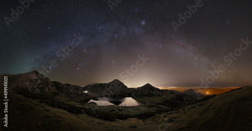 Winter night at Lake Enol with the arc of the winter milky way