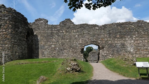 Panning shot of the ancient Inverlochy Castle ruin, Scotland, UK in nice sunny weather photo