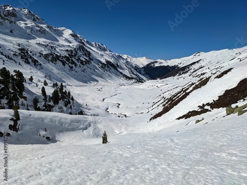 ski tour through the flüela valley in the direction of the fluela pass hospitz. Ski mountaineering in Davos in the direction of Engadin. Alone in the mountains photo