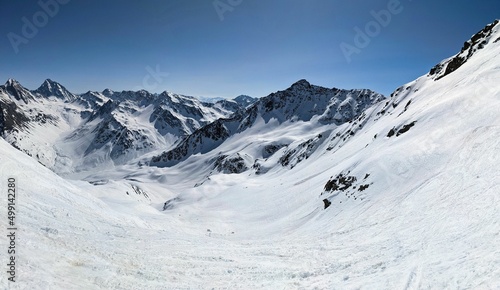 Mountain panorama on the Pischahorn above Davos Klosters Mountains. Beautiful mountain landscape with snowy mountain peaks © SimonMichael