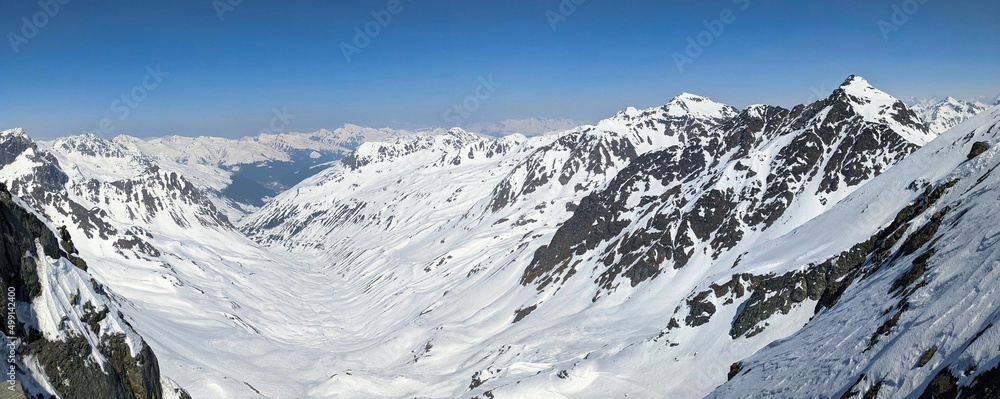 Wonderful ski tour above the Sertigpass on the Passhoreli with a view of the Chuealptal. Ski mountaineering in Davos. panoramic image