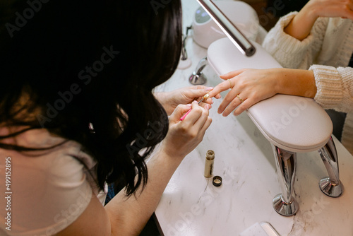 woman painting nails photo