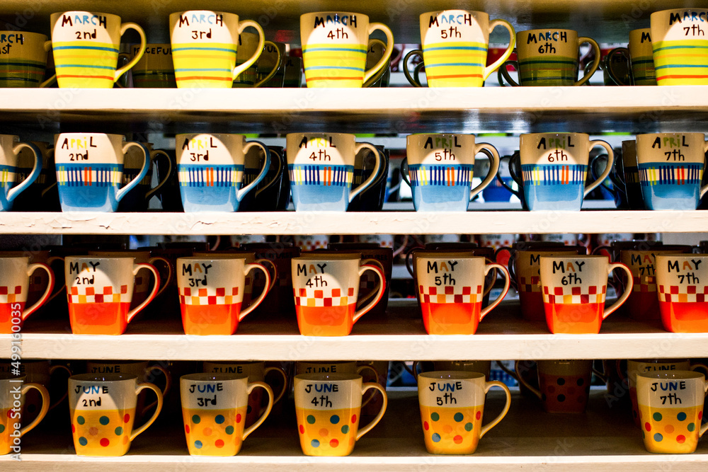 Colorful coffe cup on shelf