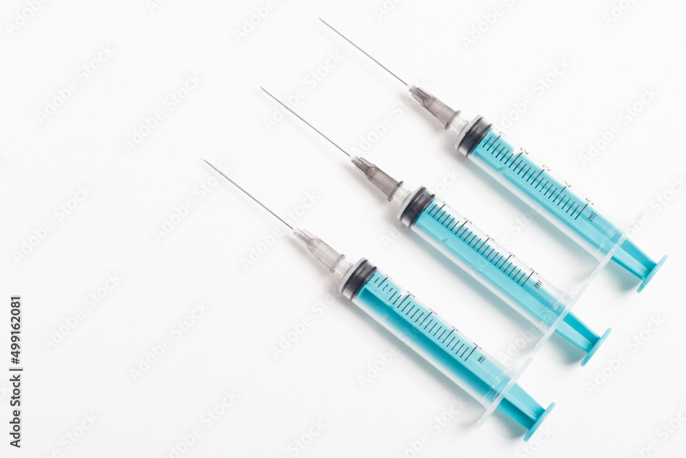 Medical syringe on a white background. A syringe for injection. The concept of health and beauty Medical syringe on a white background. A syringe for injection. The concept of health and beauty