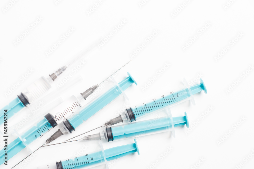 Medical syringe on a white background. A syringe for injection. The concept of health and beauty Medical syringe on a white background. A syringe for injection. The concept of health and beauty