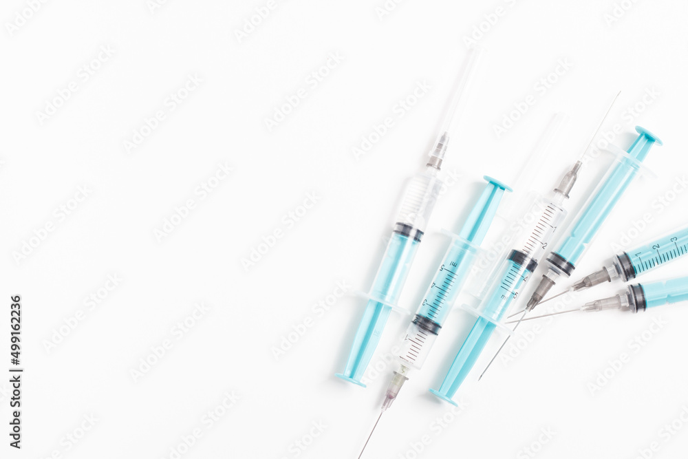Medical syringe on a white background. A syringe for injection. The concept of health and beauty Medical syringe on a white background. A syringe for injection. The concept of health and beauty