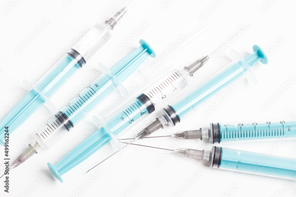 Medical syringe on a white background. A syringe for injection. The concept of health and beauty Medical syringe on a white background. A syringe for injection. The concept of health and beauty