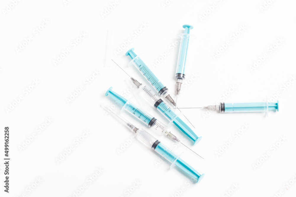 Medical syringe on a white background. A syringe for injection. The concept of health and beauty Medical syringe on a white background. A syringe for injection. The concept of health and beauty