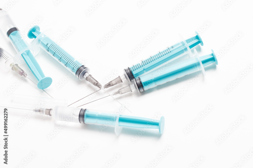 Medical syringe on a white background. A syringe for injection. The concept of health and beauty Medical syringe on a white background. A syringe for injection. The concept of health and beauty