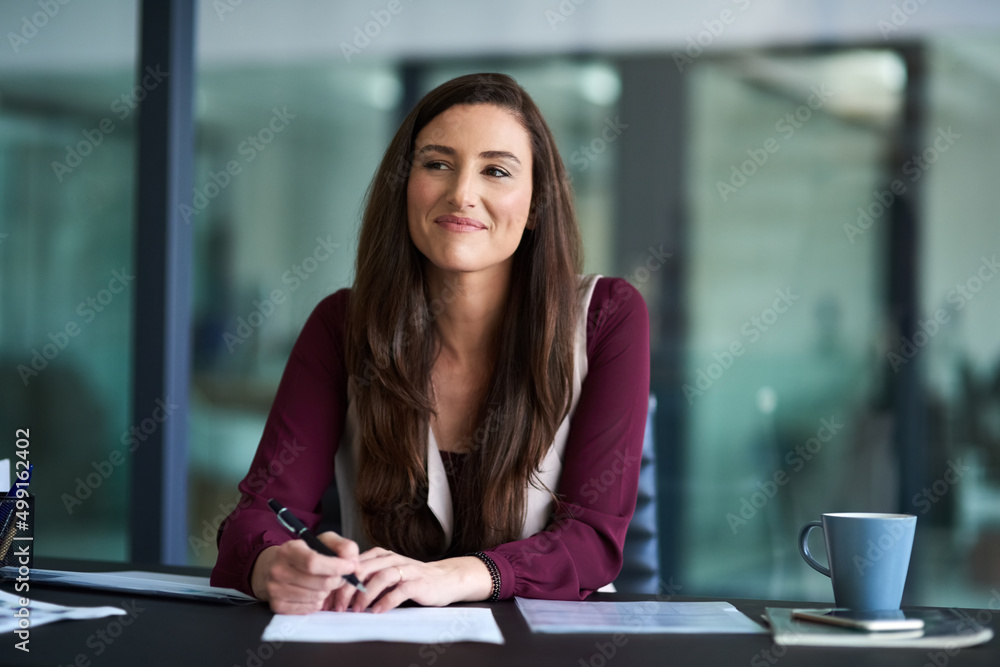 Ive got an insanely great idea. Cropped shot of an attractive young businesswoman in the office. Ive got an insanely great idea. Cropped shot of an attractive young businesswoman in the office.