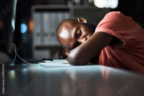 It can be tiring being the hardest worker. Cropped shot of a man falling asleep while working late at the office.