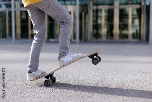 Close up of a skater on his skateboard. Outdoors activity concept. Lifestyle scene