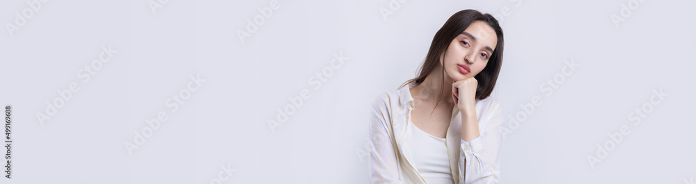 Portrait of a beautiful young woman thinking, isolated on white background Portrait of a beautiful young woman thinking, isolated on white background