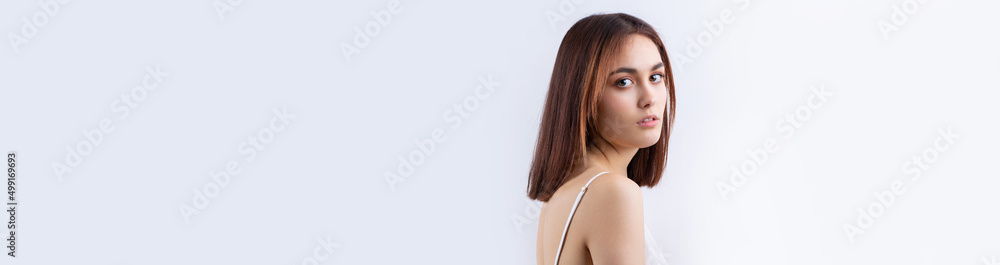 Beautiful smiling woman with clean skin, natural make-up and white teeth on a gray background Beautiful smiling woman with clean skin, natural make-up and white teeth on a gray background