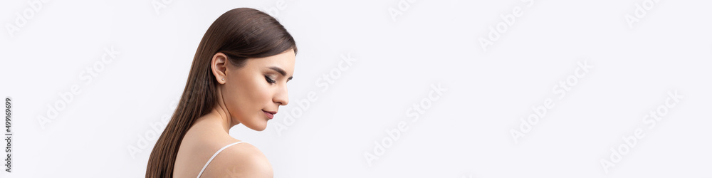 Beautiful smiling woman with clean skin, natural make-up and white teeth on a gray background Beautiful smiling woman with clean skin, natural make-up and white teeth on a gray background