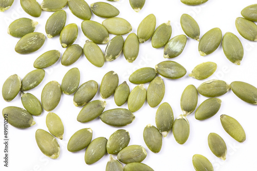 Pumpkin seeds macro view isolated on a white background. Healthy raw food