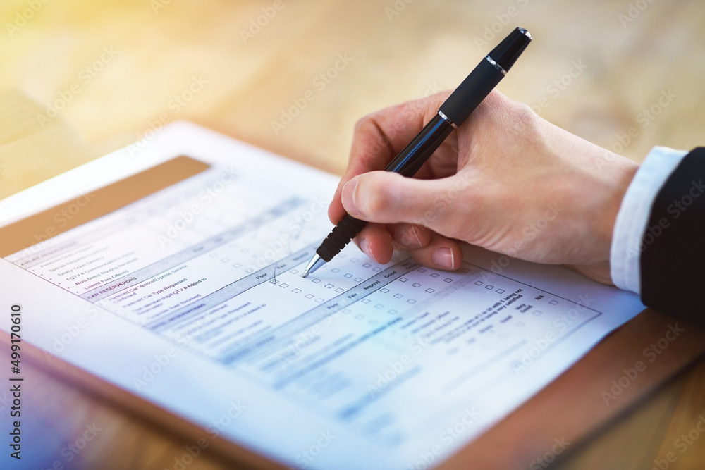 Let your opinion be heard. Cropped shot of a person filling in a form. Let your opinion be heard. Cropped shot of a person filling in a form.