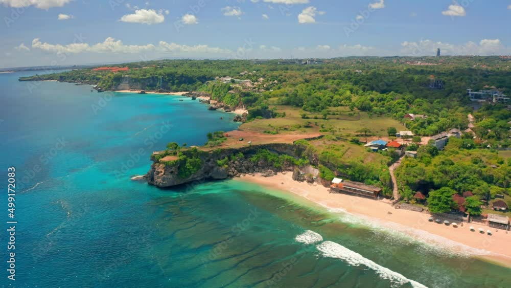 Amazing aerial top view on coastline tropical beach Balangan in Bali on nature background. 4K Shot in 4K on Hasselblad camera. Amazing aerial top view on coastline tropical beach Balangan in Bali on nature background. 4K Shot in 4K on Hasselblad camera.
