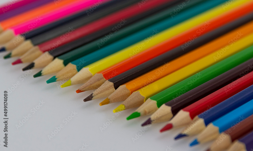 a row of coloured pencils on white background horizontal a row of coloured pencils on white background horizontal