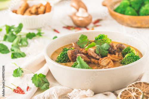 Vegan Tom Kha Gai soup with various vegetables and roasted soy-based meat substitutes photo