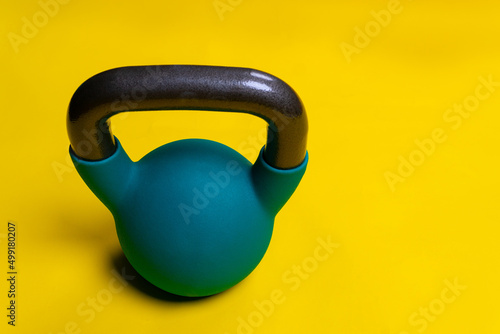For Kettlebell yellow background Blue with space on a text space iron, for cast lifting in equipment from heavy lifestyle, kettle simple. Vivid pound shape, medical retro athletic strong