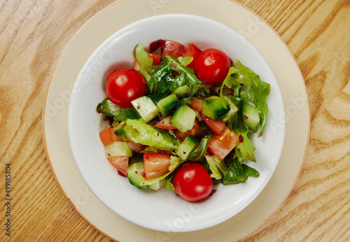 Light vegetable salad with cucumbers, lettuce, cucumbers