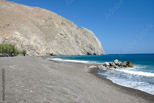 The beautiful black sandy beach of Perissa in Santorini photo