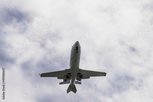 Commericial Aircraft Landing At An Internatioal Aiport During The Day photo