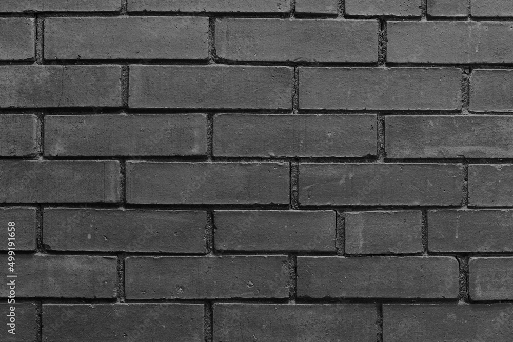 Fototapeta premium Black and white brick wall textured abstract background.