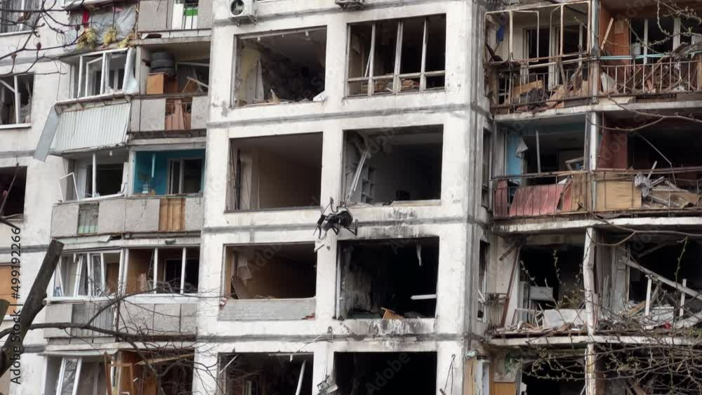 Burnt destroyed facade with broken windows of an apartment building in Kyiv after a missile strike during Ukraine's war with Russia in 2022 Burnt destroyed facade with broken windows of an apartment building in Kyiv after a missile strike during Ukraine's war with Russia in 2022