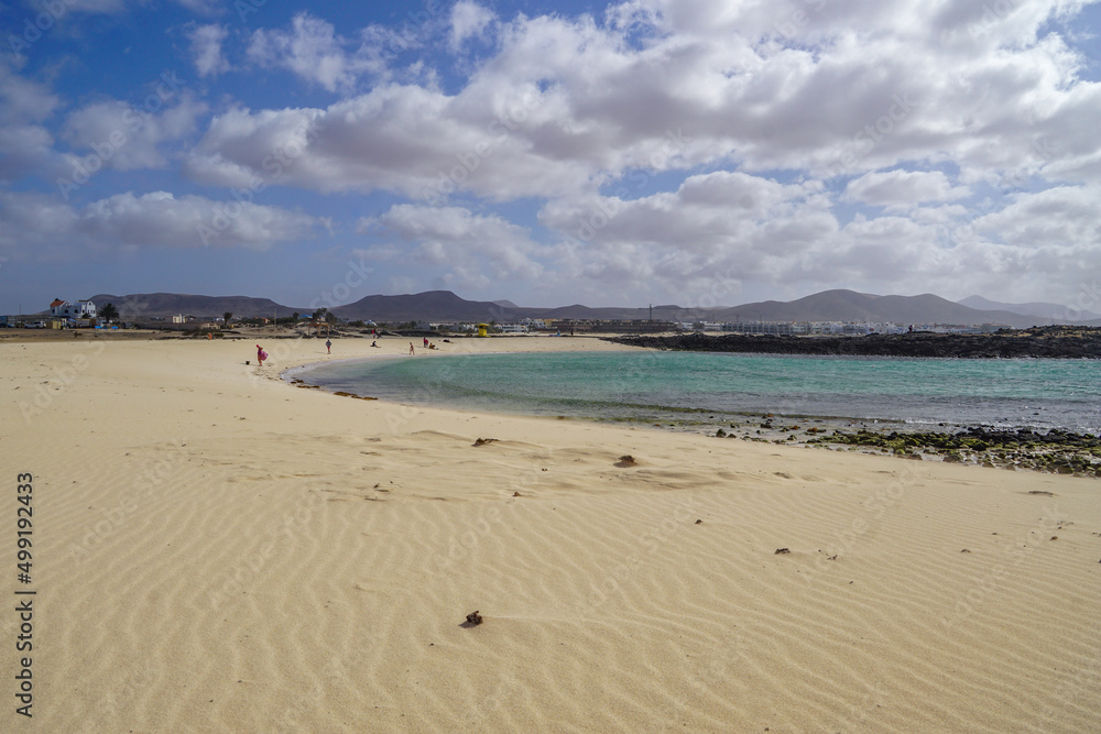 El Cotillo beach, Fuerteventura - beautiful turquoise sea with a desert sandy beach El Cotillo beach, Fuerteventura - beautiful turquoise sea with a desert sandy beach