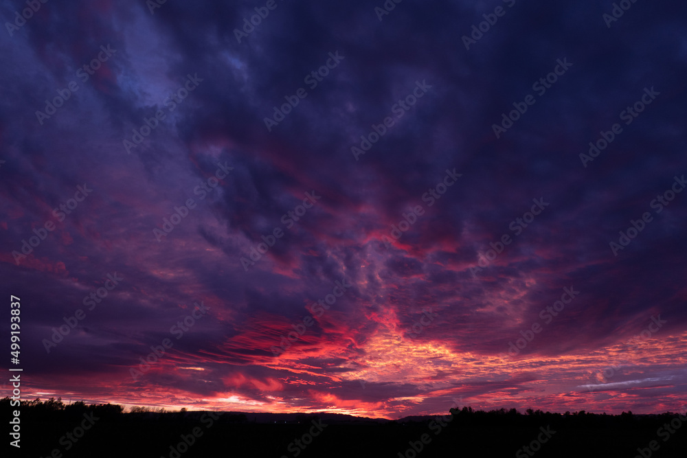 Dramatic sunset with purple blue and clouds Dramatic sunset with purple blue and clouds