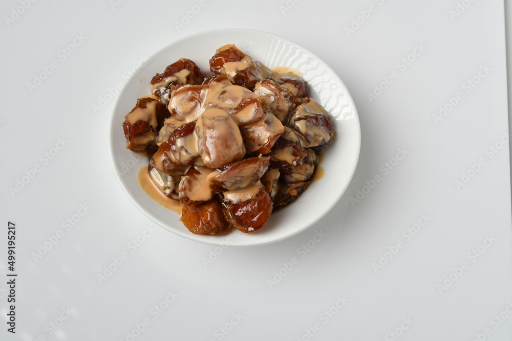 Fresh Arabian dates (Khalas dates ) isolated on white background Fresh Arabian dates (Khalas dates ) isolated on white background