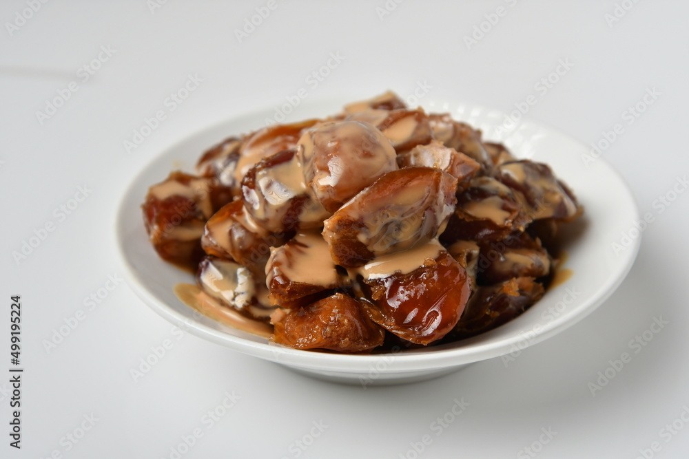 Fresh Arabian dates (Khalas dates ) isolated on white background Fresh Arabian dates (Khalas dates ) isolated on white background