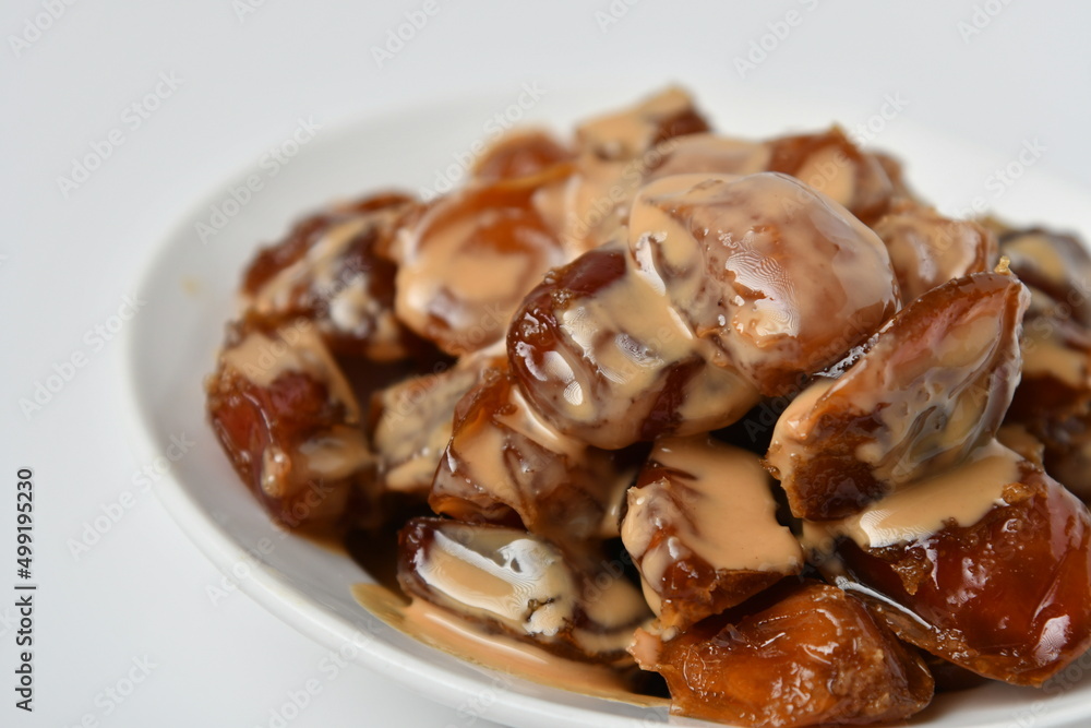 Fresh Arabian dates (Khalas dates ) isolated on white background Fresh Arabian dates (Khalas dates ) isolated on white background