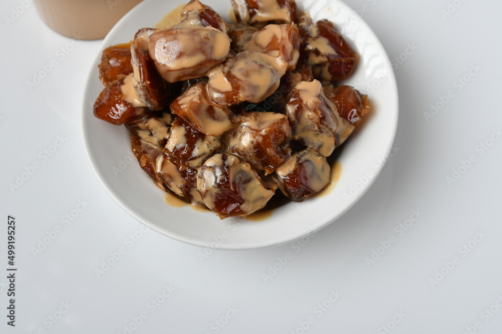 Fresh Arabian dates (Khalas dates ) isolated on white background Fresh Arabian dates (Khalas dates ) isolated on white background