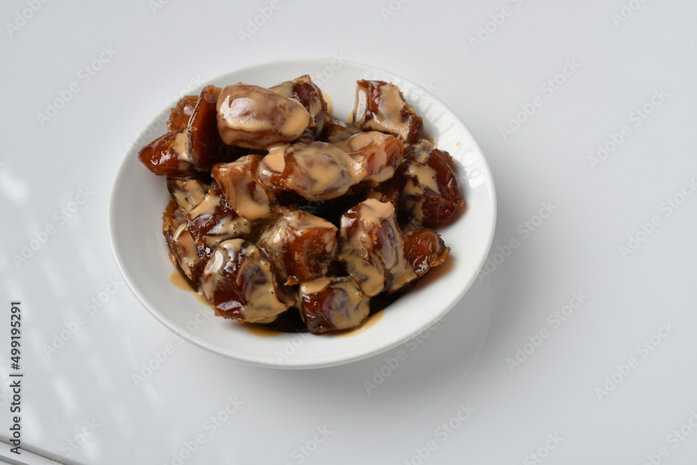 Fresh Arabian dates (Khalas dates ) isolated on white background Fresh Arabian dates (Khalas dates ) isolated on white background