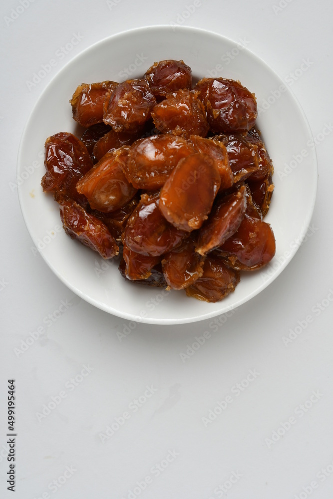 Fresh Arabian dates (Khalas dates ) isolated on white background Fresh Arabian dates (Khalas dates ) isolated on white background