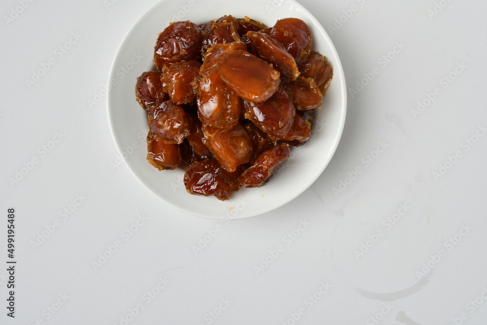 Fresh Arabian dates (Khalas dates ) isolated on white background Fresh Arabian dates (Khalas dates ) isolated on white background
