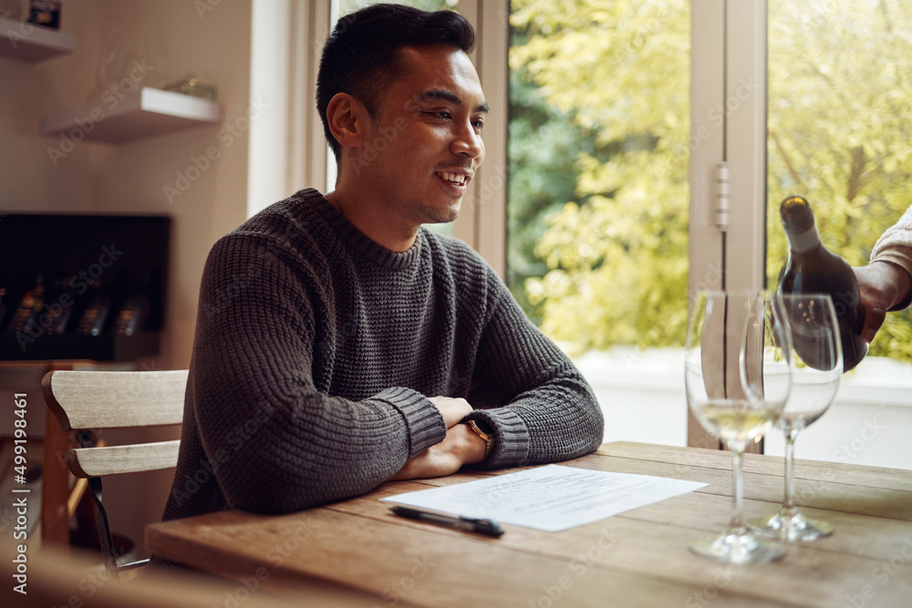 Im a fan of wine tasting. Shot of a young man out wine tasting. Im a fan of wine tasting. Shot of a young man out wine tasting.