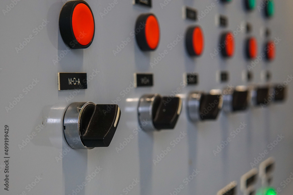 Electrical selector switch,button switch,Electrical switch gear at Low Voltage motor control center cabinet in coal power plant. blurred for background. Electrical selector switch,button switch,Electrical switch gear at Low Voltage motor control center cabinet in coal power plant. blurred for background.