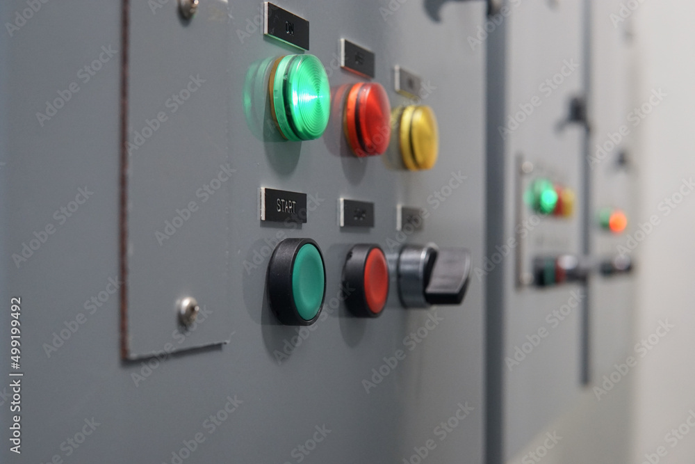Electrical selector switch,button switch,Electrical switch gear at Low Voltage motor control center cabinet in coal power plant. blurred for background. Electrical selector switch,button switch,Electrical switch gear at Low Voltage motor control center cabinet in coal power plant. blurred for background.
