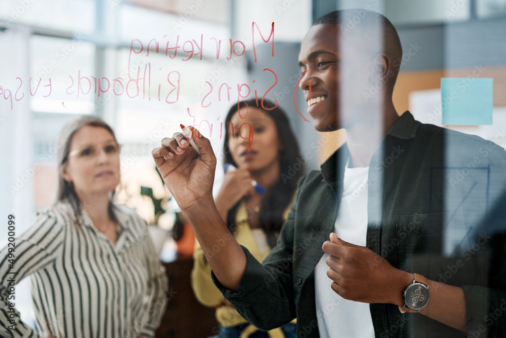 Fototapeta premium Success is never of vicarious nature, work until its yours. Shot of a group of businesspeople brainstorming in a modern office.